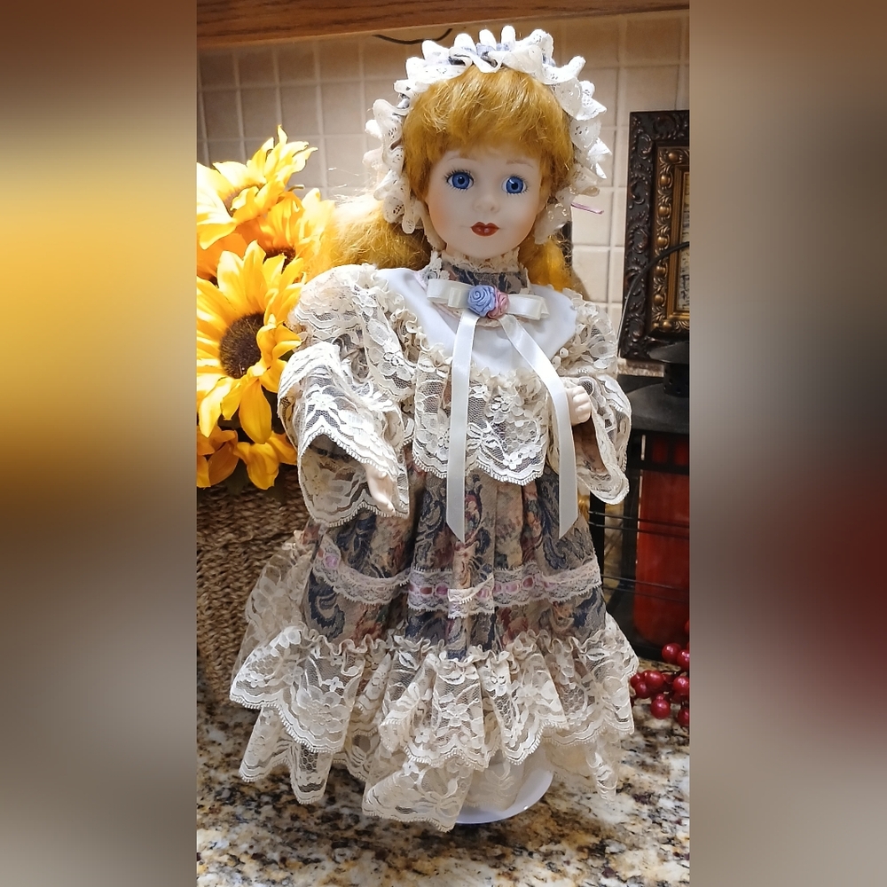 Antique Porcelain Doll with Lace Dress and Blue Eyes